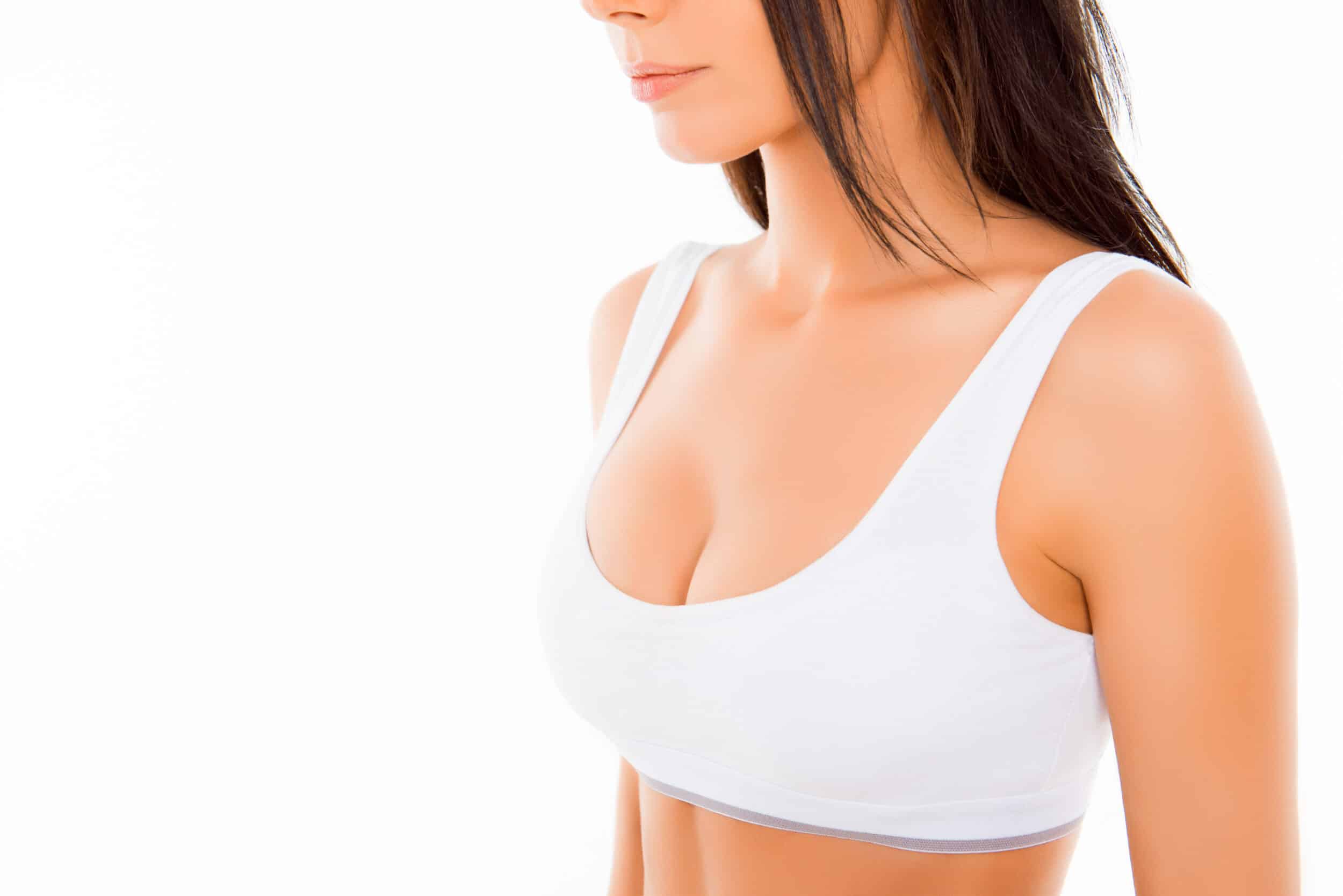 Woman's breasts in bra after breast lift surgery in Calgary, AB