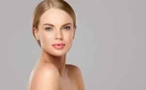 Woman with smooth, youthful skin after dermal fillers.